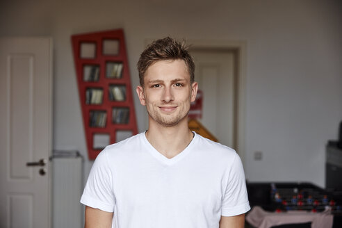 Portrait of smiling young man at home - RHF02199