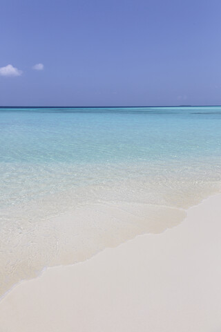 Tranquil, sunny blue ocean beach, Maldives, Indian Ocean stock photo