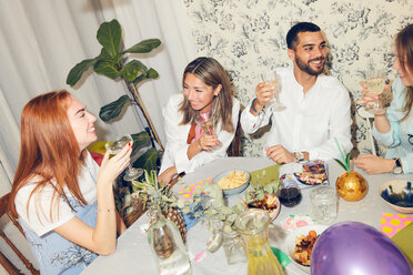 High angle view of young multi-ethnic friends enjoying dinner party at home - MASF09697