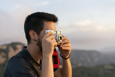 Spain, Barcelona, Natural Park of Sant Llorenc, man taking a picture of the view - AFVF01895