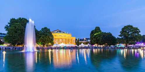 Germany, Stuttgart, palace garden, Eckensee, state theatre, opera house during summer party, blue hour - WDF04853