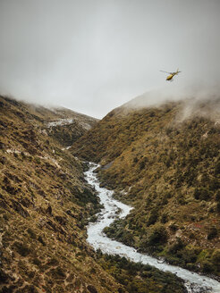 Scenic view of river amidst mountains against cloudy sky at Sagarmatha National Park - CAVF52376