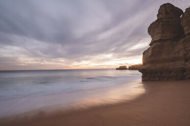 Scenic view of sea against cloudy sky during sunset - CAVF52546