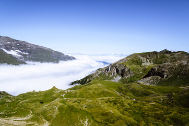 Idyllic view of mountain ranges by clouds against sky - CAVF53099