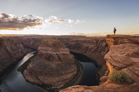 USA, Arizona, Colorado River, Horseshoe Bend, young man standing on viewpoint stock photo