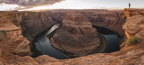 USA, Arizona, Colorado River, Horseshoe Bend, young man standing on viewpoint stock photo