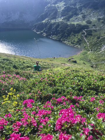 Austria, Tyrol, Fieberbrunn, woman in mountainscape stock photo