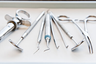 Closeup of medical tools on a tray in a dental surgery. - MINF09189