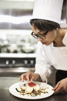 A black female chef working in a commercial kitchen, - MINF09210