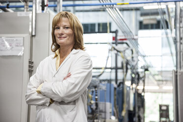 A portrait of a Caucasian female technician in a technical research and development site. - MINF09318