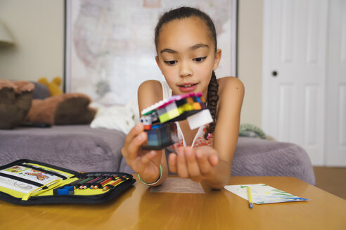 Tween Girl Playing with Building Blocks - MINF09415