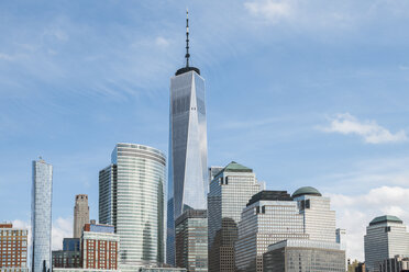 One World Trade Center by buildings against sky in city - CAVF53275