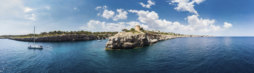Spain, Balearic Islands, Mallorca, Llucmajor, Aerial view of bay of Cala Pi and Torre de Cala Pi - AMF06156