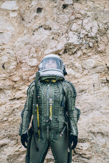 Woman in space suit exploring nature - OCMF00088