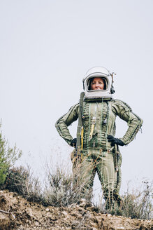 Woman in space suit exploring nature - OCMF00089