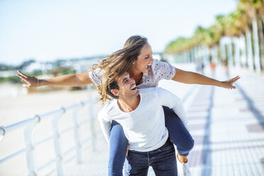 Carefree young couple on promenade - KIJF02072