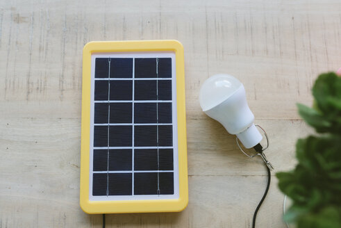 Renewable energy technology, solar panel charging a light bulb - GEMF02494