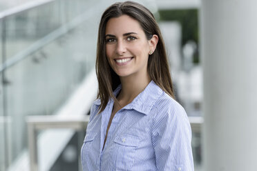 Portrait of smiling young businesswoman - BMOF00075