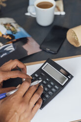 Hand of a woman using calculator - BOYF00928