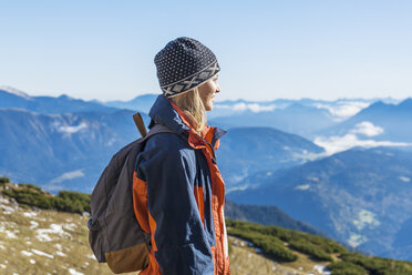 Germany, Garmisch-Partenkirchen, Alpspitze, Osterfelderkopf, female hiker on viewpoint looking at view - TCF05922