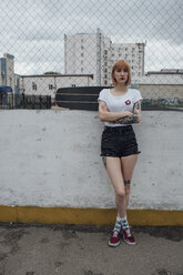 Cool young woman with carver skateboard standing outdoors - VPIF00964