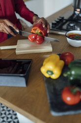 Hands of a woman, chopping bell peppers on a chopping board - BOYF00963