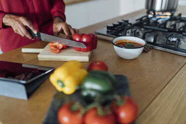 Hands of a woman, chopping bell peppers on a chopping board - BOYF00964