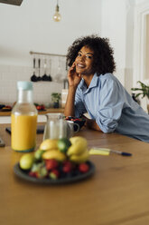 Woman having a healthy breakfast in her kitchen - BOYF01062