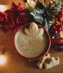 Overhead view of cookie in hot chocolate on table during Christmas - CAVF54763