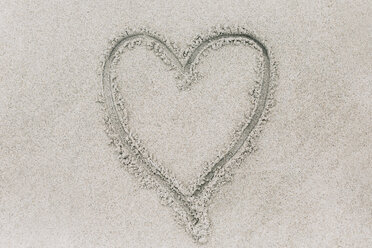 Overhead view of heart shape on sand at beach - CAVF54833