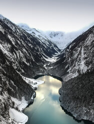 High angle view of lake amidst mountains against sky during winter - CAVF54845