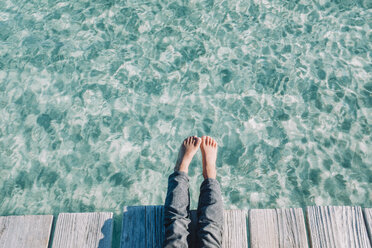 Close up of the kids feet over turquoise waters, Mallorca, Balearic Islands, Spain - AURF07773