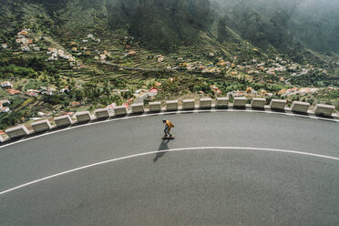 High angle view of man skateboarding on road - CAVF54985