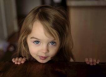 Close-up of portrait of cute girl at home - CAVF55022