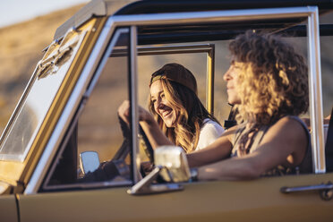 Happy female friends in off-road vehicle - CAVF55213