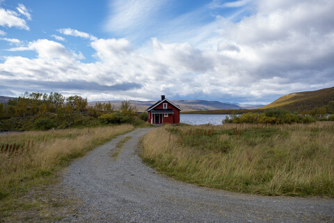 Finland, Lappland, Kilpisjaervi, wooden hut at lake stock photo