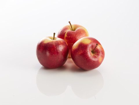 Three red apples on white background stock photo