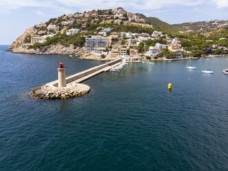 Spain, Balearic Islands, Mallorca, Andratx Region, Aerial view of Port d'Andratx, coast and natural harbour with lighthouse - AMF06232