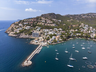 Spain, Balearic Islands, Mallorca, Andratx Region, Aerial view of Port d'Andratx, coast and natural harbour with lighthouse - AMF06239