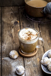 Pumpkin spice latte with a dollop of cream and some cookies - SBDF03836