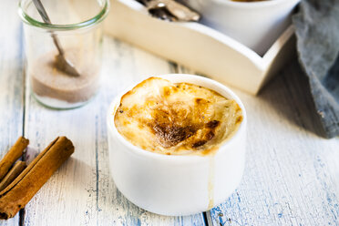 Bowl of Turkish oven baked rice pudding with cinnamon - SBDF03855