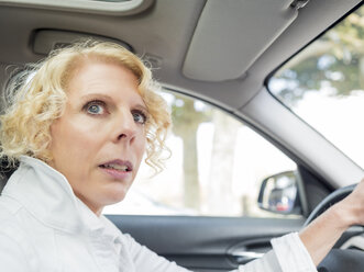 Portrait of mature woman driving car - LAF02167