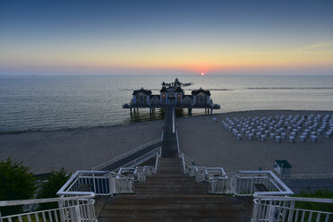 Germany, Mecklenburg-Western Pomerania, Ruegen, Sellin, view to sea bridge at sunset - FDF00274