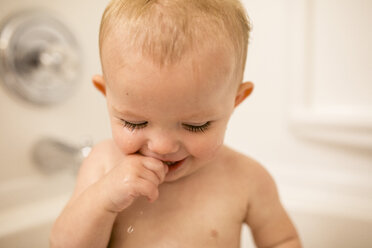 Close-up of baby girl in bathtub - CAVF56036