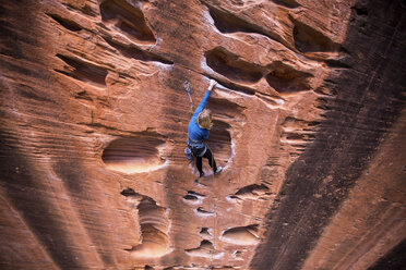 High angle view of woman rock climbing at Zion National Park - CAVF56090