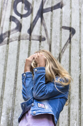 Blond girl hiding her face - JFEF00924