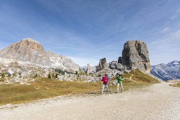 Italy, Cortina d'Ampezzo, two people hiking in the Dolomites mountain area - WPEF01131