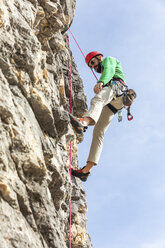 Italy, Cortina d'Ampezzo, man climbing in the Dolomites mountains - WPEF01143