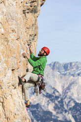 Italy, Cortina d'Ampezzo, man climbing in the Dolomites mountains - WPEF01150