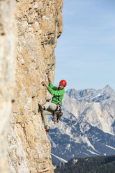 Italy, Cortina d'Ampezzo, man climbing in the Dolomites mountains - WPEF01151